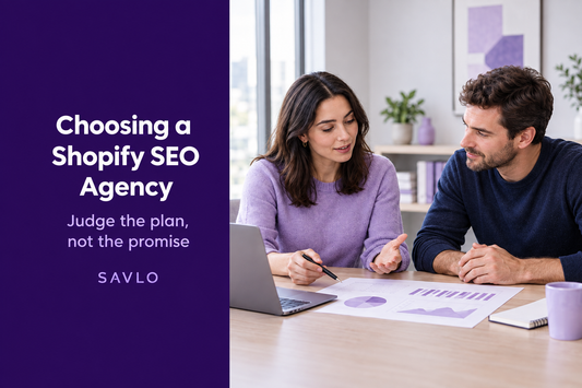 Two professionals reviewing a printed proposal beside a laptop, above “Choosing a Shopify SEO Agency” text.⠋