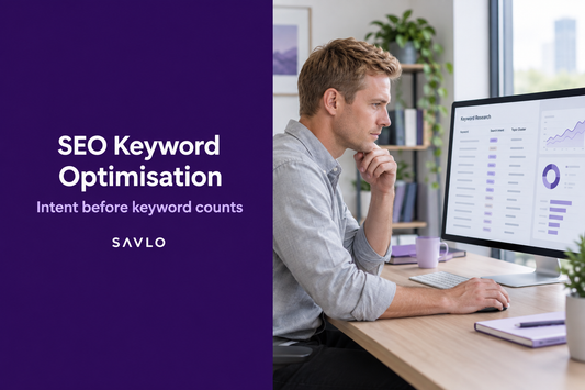 Man reviewing keyword research and charts on a monitor beside “SEO Keyword Optimisation” text on a deep-purple panel.